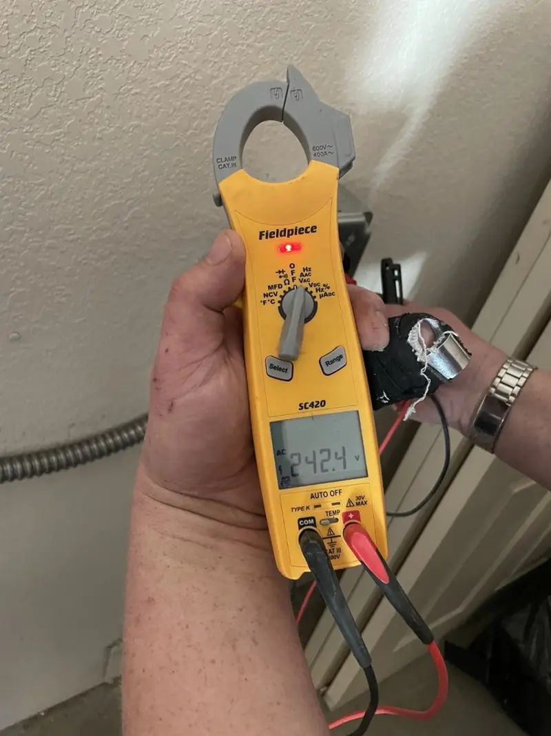 Voltage testing with clamp meter during Outlet Installation in Tioga